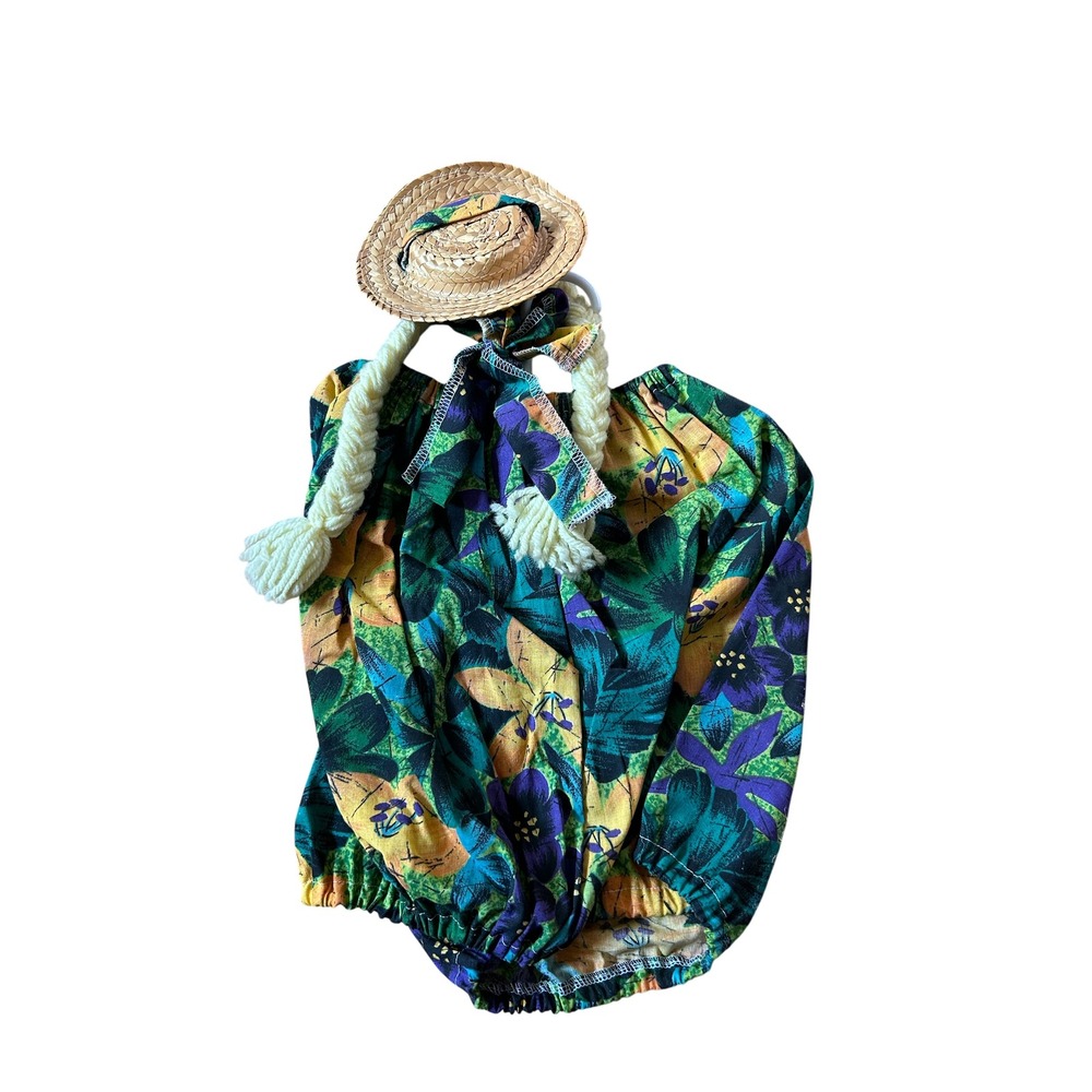 Dress your concrete goose with a floral summer dress, hat, and‎ braids vintage